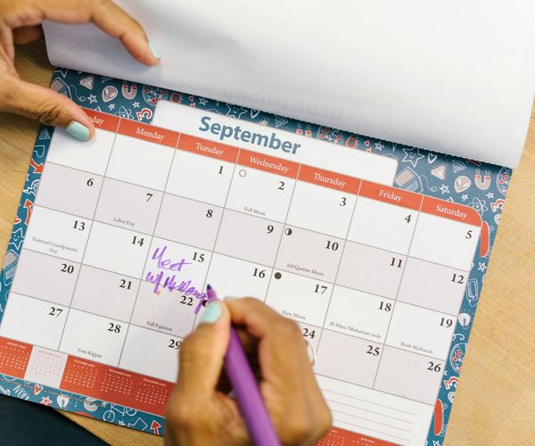 Calendar with marked dates symbolizing a consistent workout schedule.